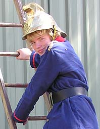 Fireman Alex in an 1890s fireman's uniform